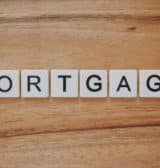The word mortgage spelt out on a wooden background