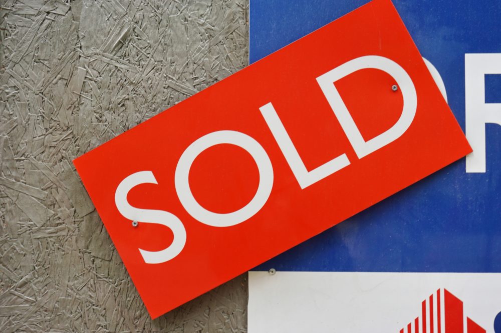 A sold sign on a house