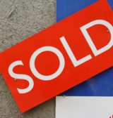 A sold sign on a house