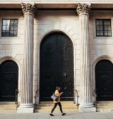 A woman walking past the Bank of England in London